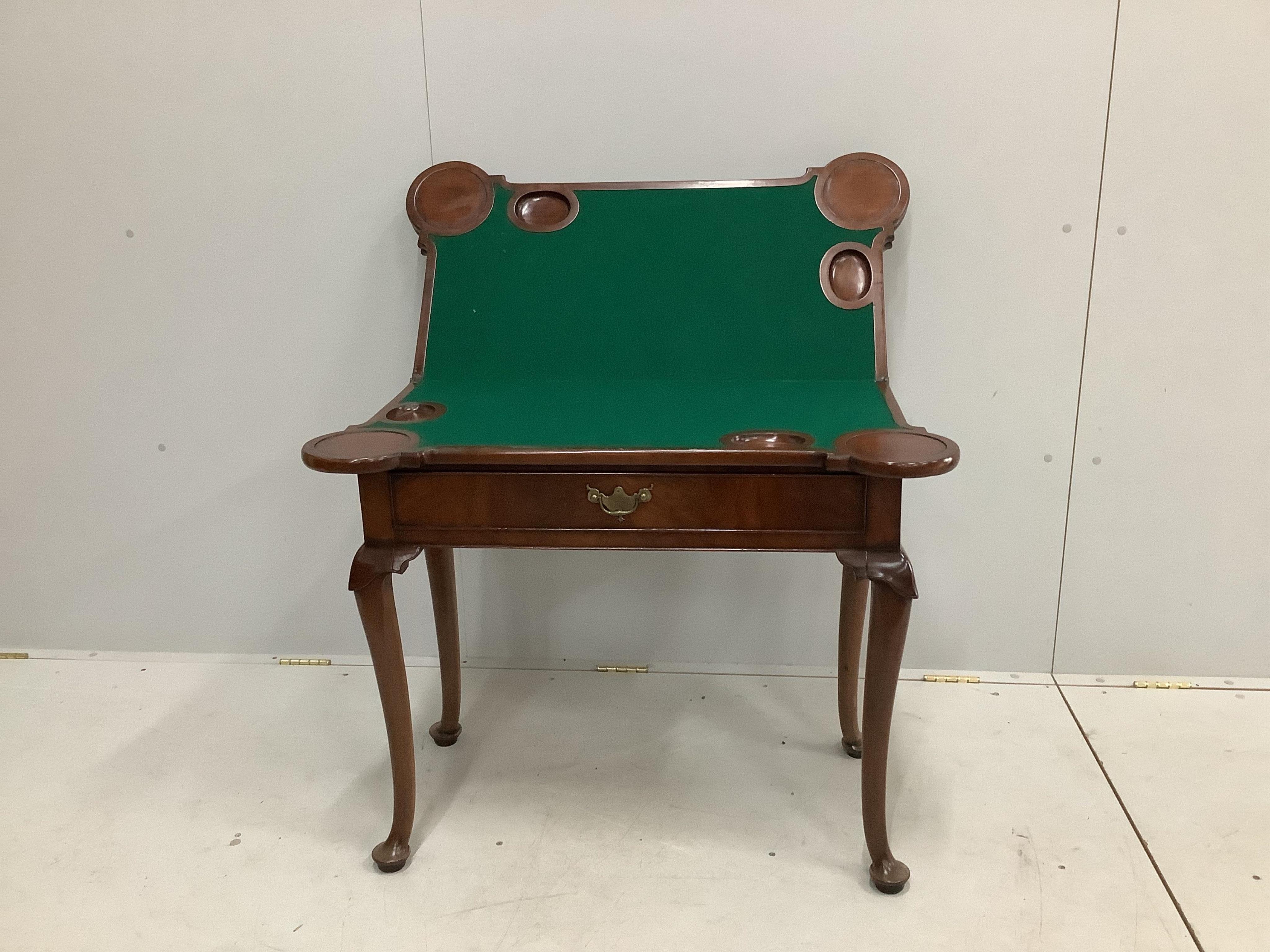 An 18th century mahogany double folding tea / card table, width 90cm, depth 45cm, height 74cm. Condition - fair